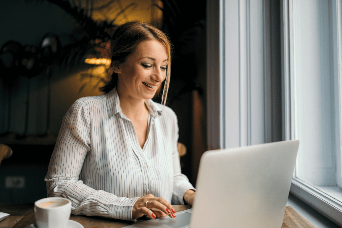 Woman on laptop smiling