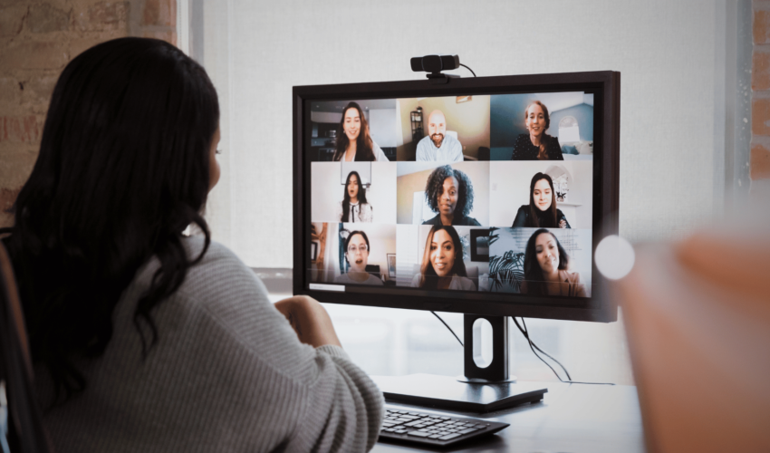 woman on video conference with remote team members