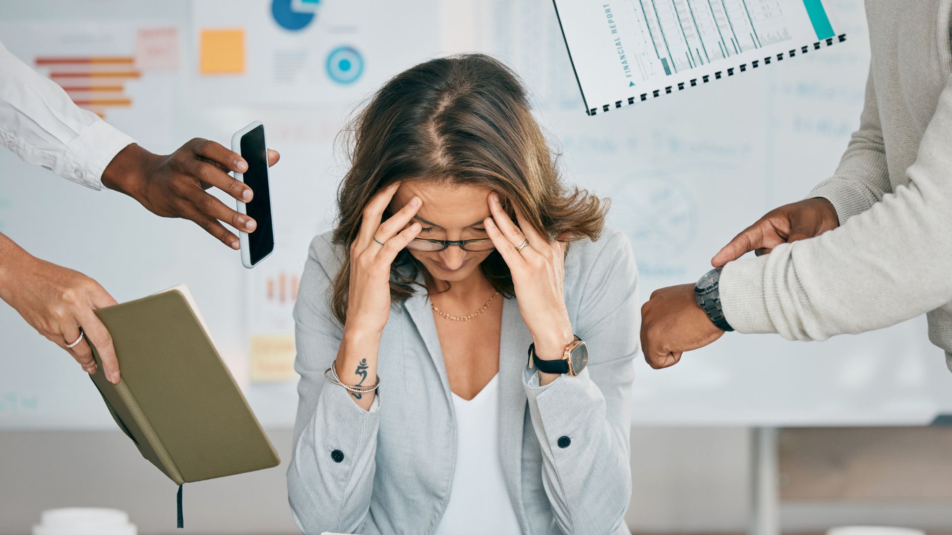 WorkFromPH.com blog photo of an overwhelmed woman business owner, multitasking female in office with demands from everyone